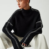 Alma | Suéter oversize de cuello alto en piqué con detalles